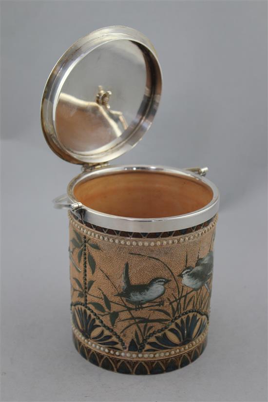 A Doulton Lambeth stoneware biscuit barrel, by Florence E. Barlow, dated 1884, 16cm. to finial